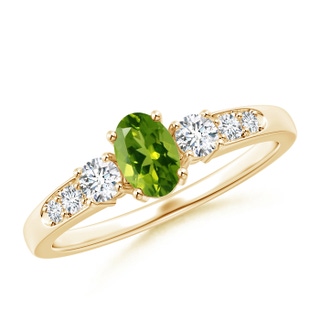 6x4mm AAAA Three Stone Peridot and Diamond Ring with Accents in Yellow Gold