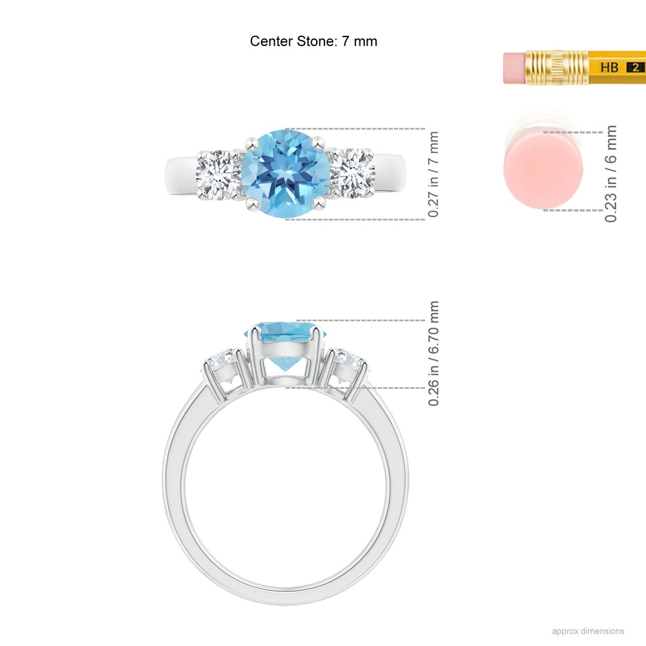 7mm A Classic Swiss Blue Topaz and Diamond Three Stone Ring in White Gold ruler