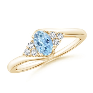 6x4mm AAA Oval Aquamarine Bypass Ring with Trio Diamond Accents in Yellow Gold