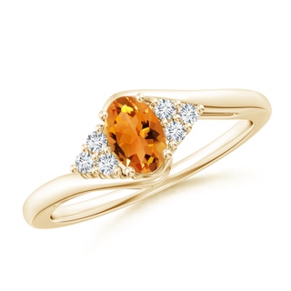 6x4mm AAA Oval Citrine Bypass Ring with Trio Diamond Accents in Yellow Gold