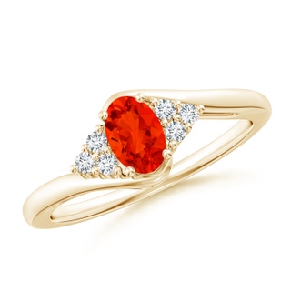 6x4mm AAAA Oval Fire Opal Bypass Ring with Trio Diamond Accents in Yellow Gold