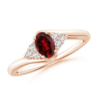 6x4mm AAAA Oval Garnet Bypass Ring with Trio Diamond Accents in Rose Gold