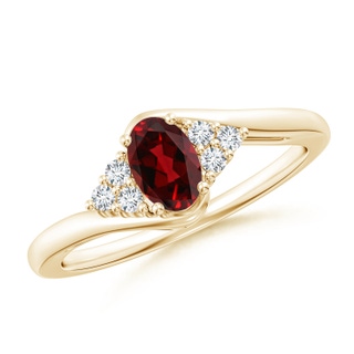 6x4mm AAAA Oval Garnet Bypass Ring with Trio Diamond Accents in Yellow Gold