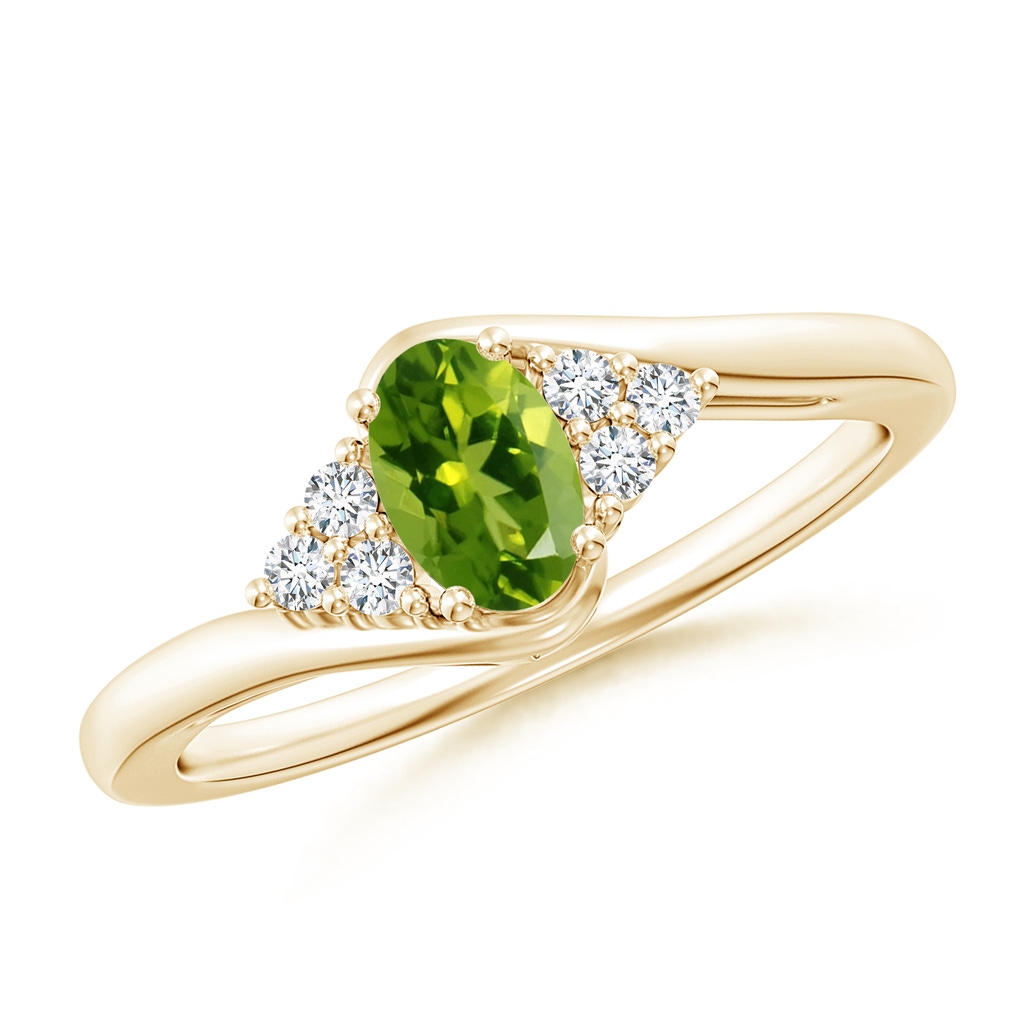 6x4mm AAAA Oval Peridot Bypass Ring with Trio Diamond Accents in Yellow Gold