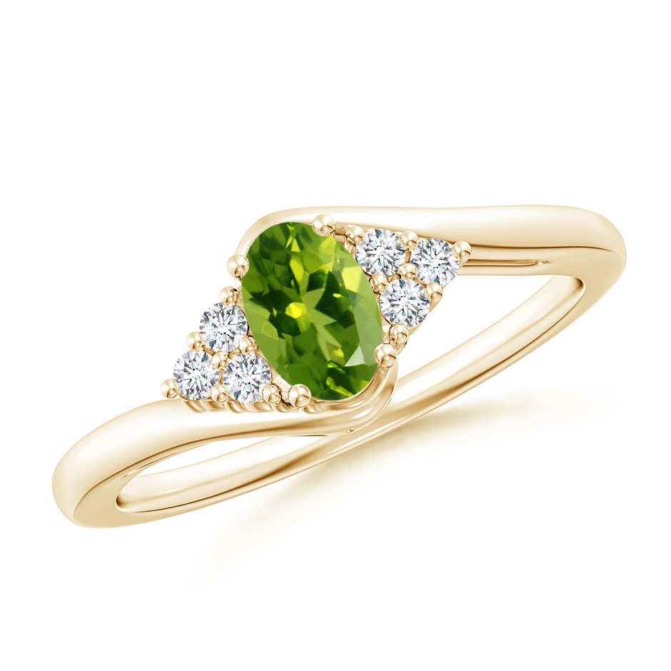 6x4mm AAAA Oval Peridot Bypass Ring with Trio Diamond Accents in Yellow Gold 