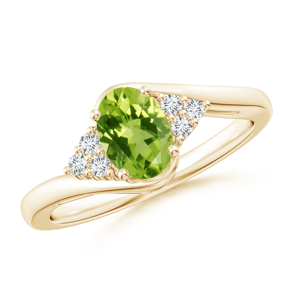 7x5mm AAA Oval Peridot Bypass Ring with Trio Diamond Accents in Yellow Gold 