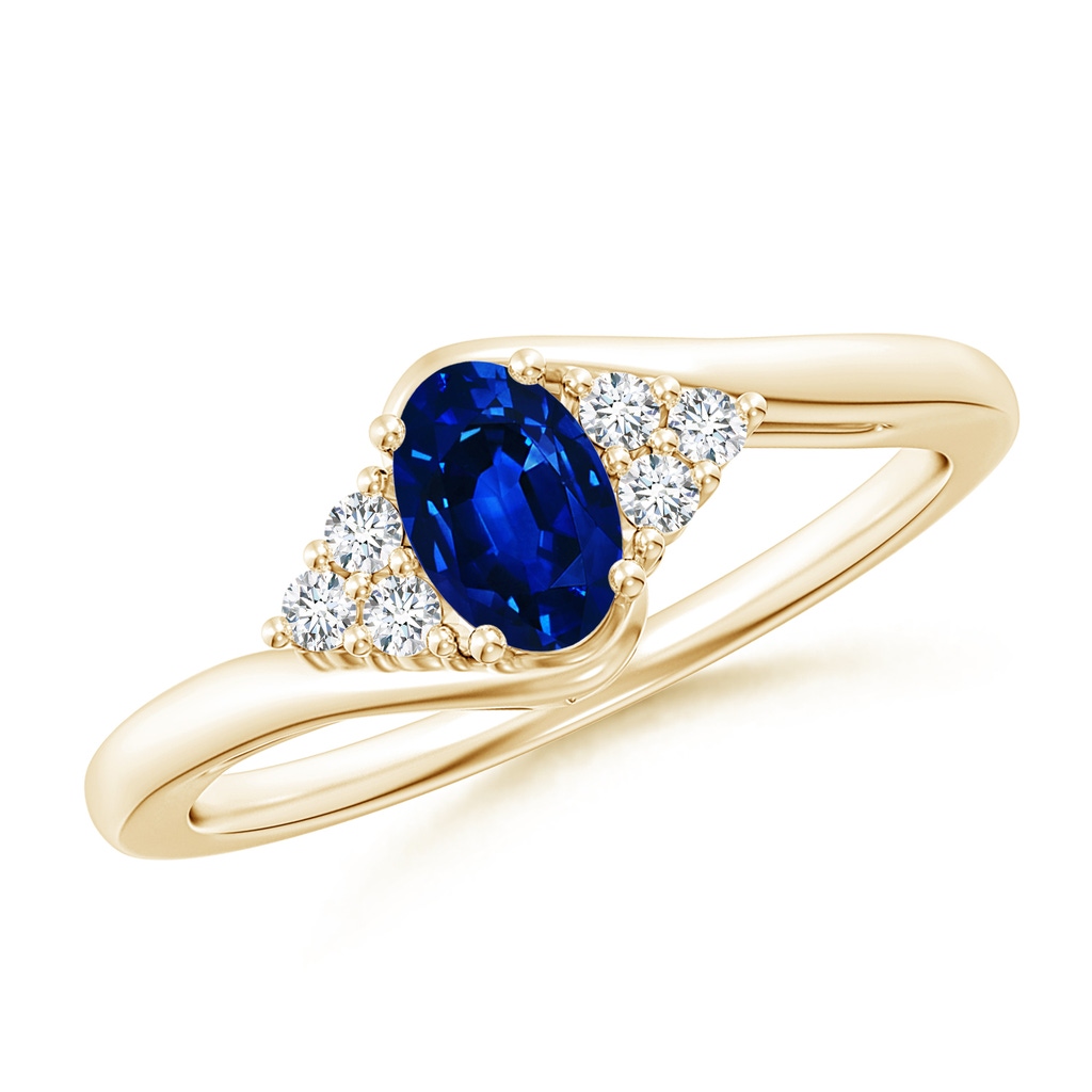 6x4mm AAAA Oval Sapphire Bypass Ring with Trio Diamond Accents in Yellow Gold