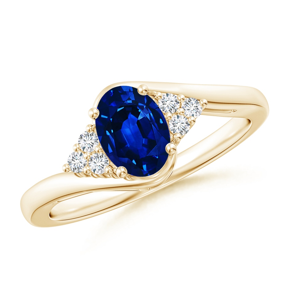 7x5mm AAAA Oval Sapphire Bypass Ring with Trio Diamond Accents in Yellow Gold 