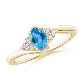 6x4mm AAA Oval Swiss Blue Topaz Bypass Ring with Trio Diamond Accents in Yellow Gold