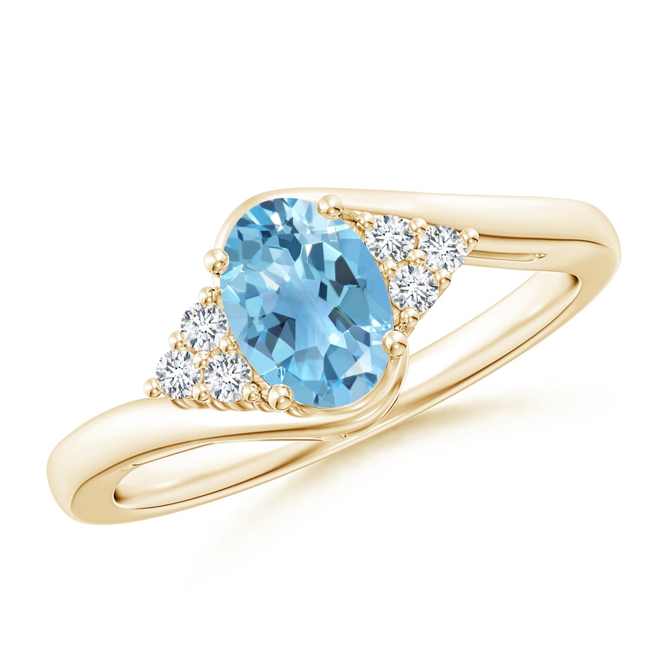 7x5mm A Oval Swiss Blue Topaz Bypass Ring with Trio Diamond Accents in Yellow Gold 