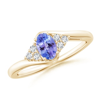 6x4mm AAA Oval Tanzanite Bypass Ring with Trio Diamond Accents in 9K Yellow Gold