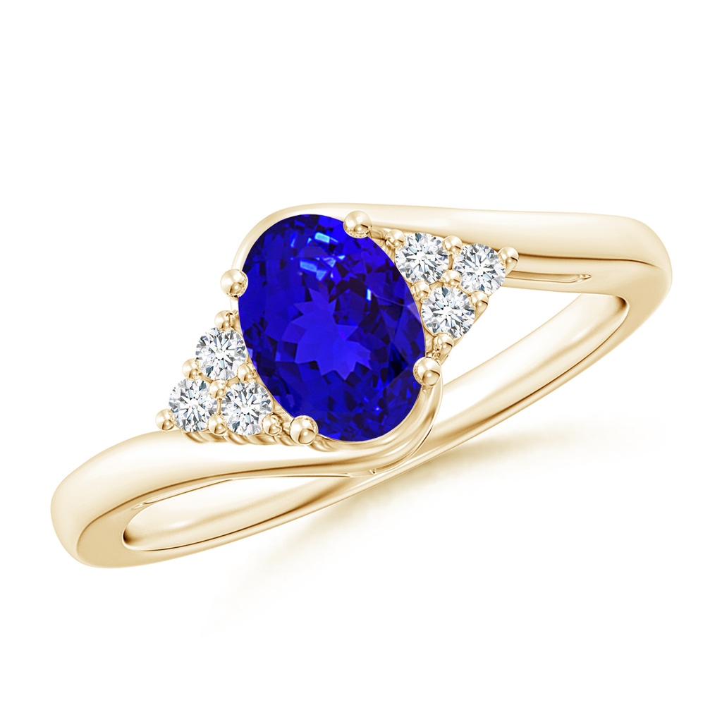 7x5mm AAAA Oval Tanzanite Bypass Ring with Trio Diamond Accents in Yellow Gold