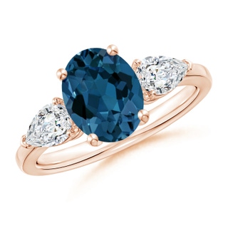 9x7mm AAA Oval London Blue Topaz Three Stone Ring with Pear Diamonds in Rose Gold