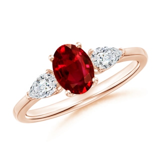7x5mm AAAA Oval Ruby Three Stone Ring with Pear Diamonds in 10K Rose Gold