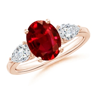 9x7mm AAAA Oval Ruby Three Stone Ring with Pear Diamonds in 10K Rose Gold