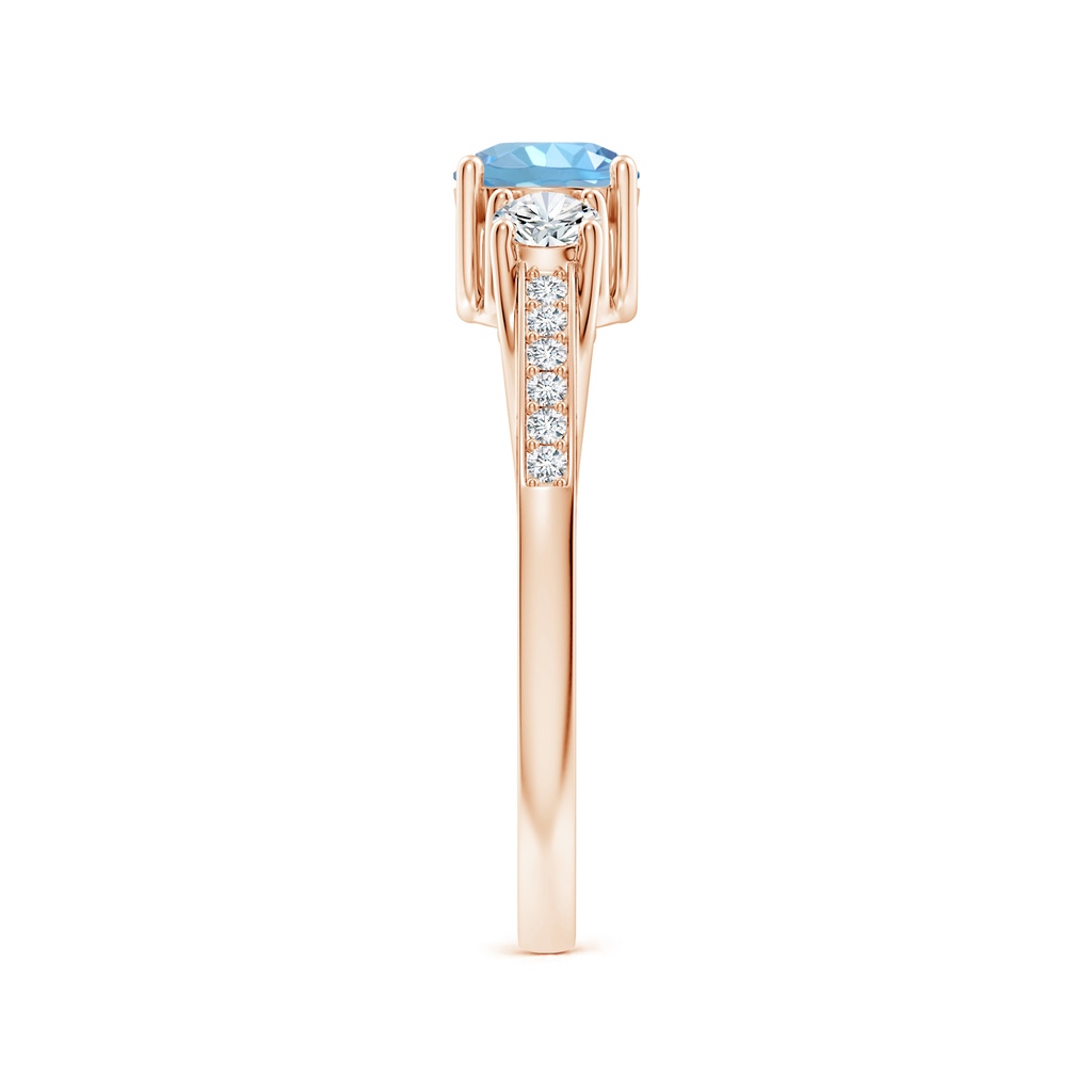 5mm AAAA Classic Prong Set Round Aquamarine and Diamond Three Stone Ring in Rose Gold Body-Hand