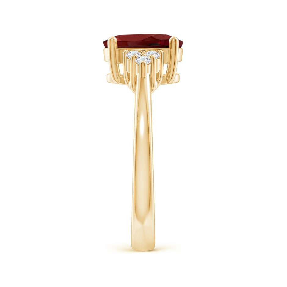 9x7mm AAAA Solitaire Oval Garnet Ring with Trio Diamond Accents in Yellow Gold side 2