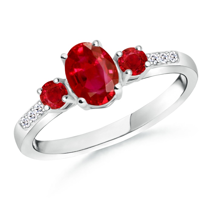 7x5mm AAA Oval Ruby Three Stone Ring with Diamond Accents in White Gold