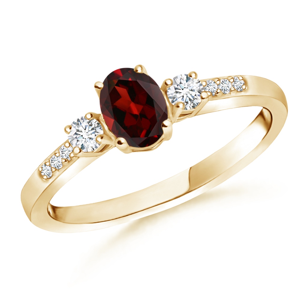 6x4mm AAA Classic Oval Garnet and Round Diamond Three Stone Ring in Yellow Gold