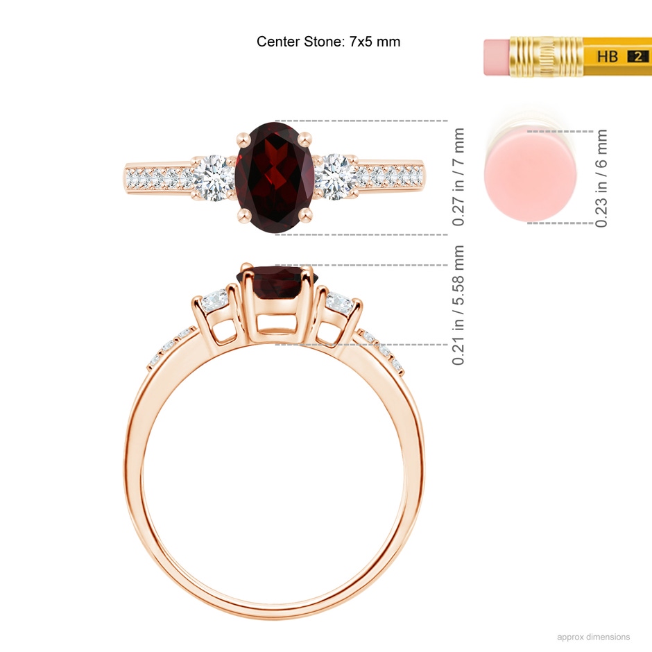 7x5mm A Classic Oval Garnet and Round Diamond Three Stone Ring in Rose Gold ruler