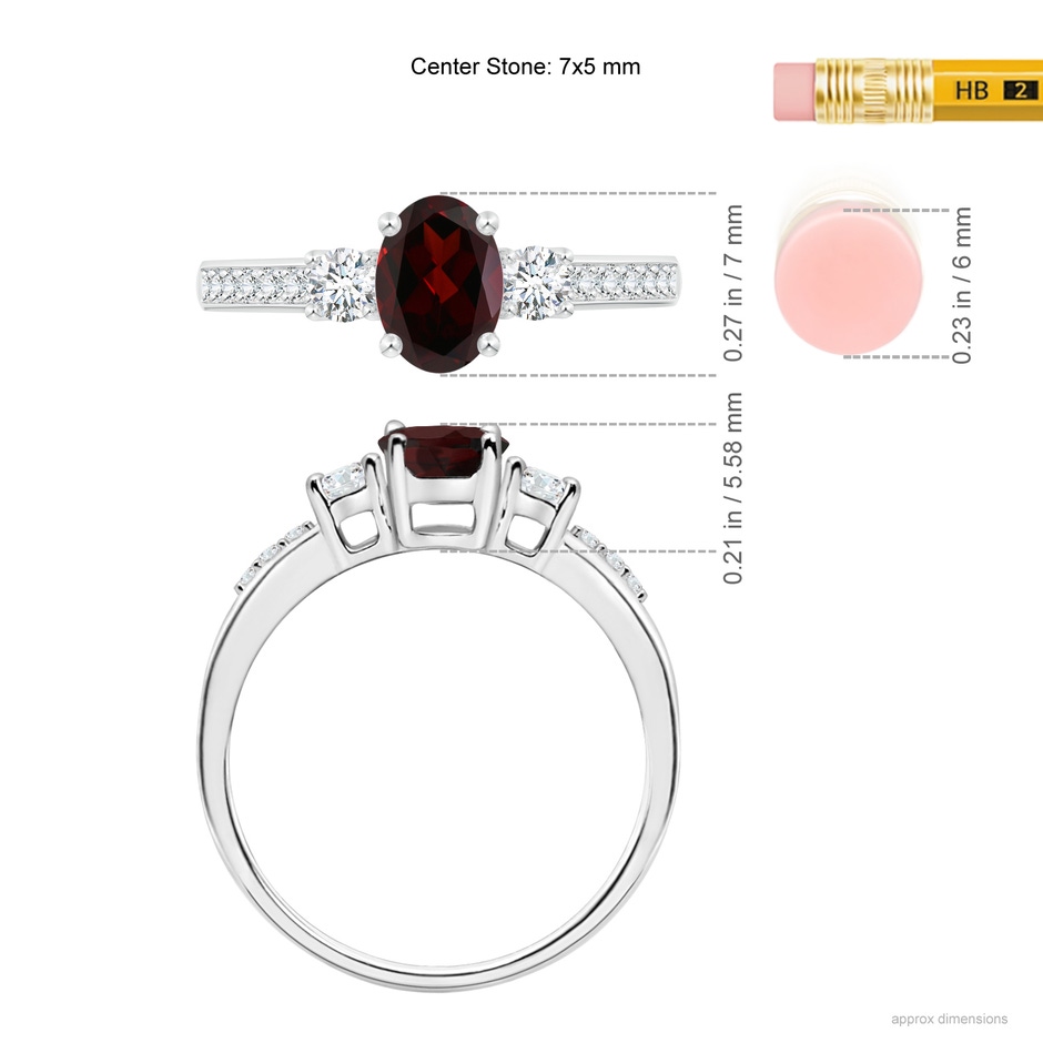 7x5mm A Classic Oval Garnet and Round Diamond Three Stone Ring in White Gold ruler