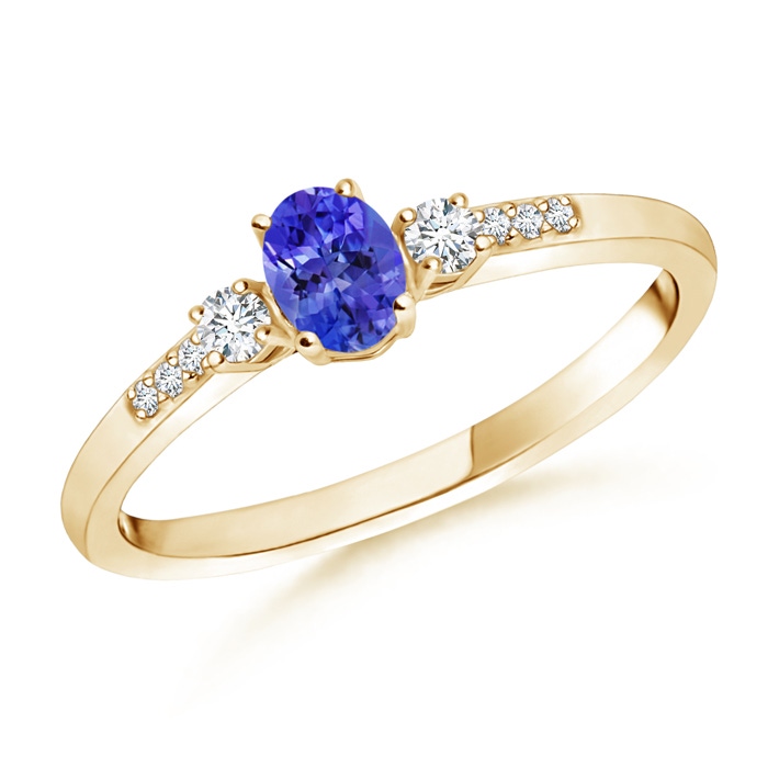 5x3mm AAAA Classic Oval Tanzanite and Round Diamond Three Stone Ring in Yellow Gold