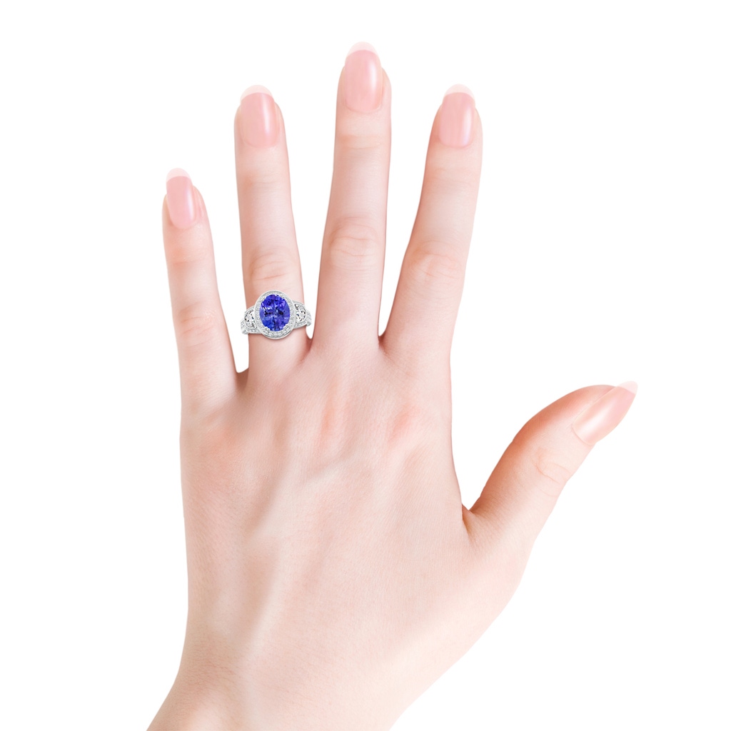 10x8mm AAA Oval Tanzanite Three Stone Ring with Diamonds in White Gold Product Image