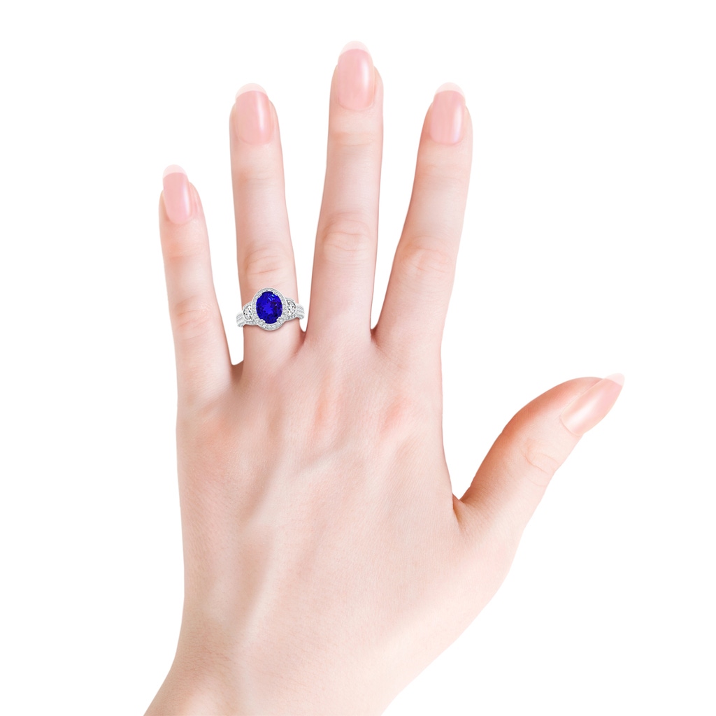 9x7mm AAAA Oval Tanzanite Three Stone Ring with Diamonds in White Gold Product Image