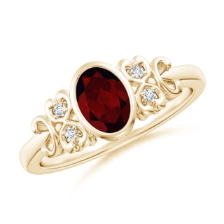 7x5mm A Vintage Style Bezel-Set Oval Garnet Ring with Diamonds in 9K Yellow Gold