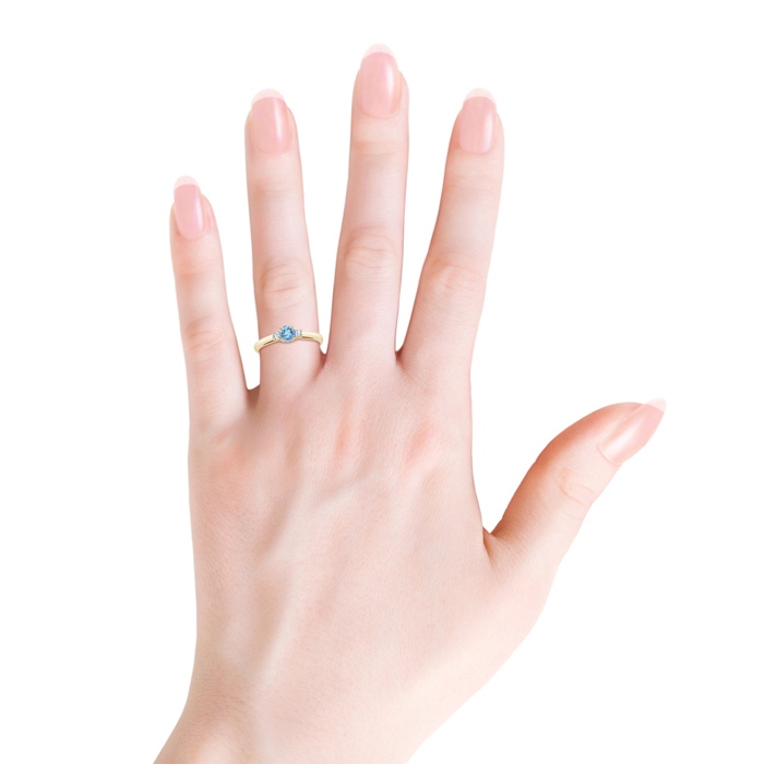 5mm AAAA Round Aquamarine & Diamond Three Stone Engagement Ring in Yellow Gold Body-Hand