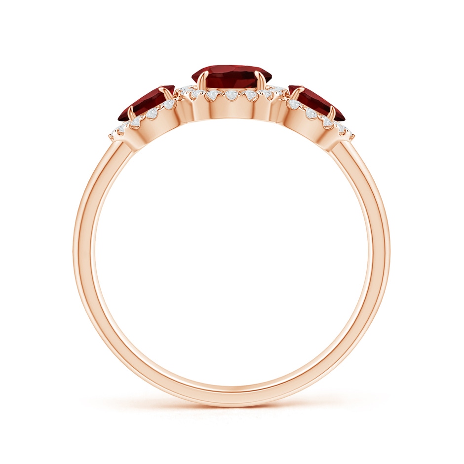 7x5mm AAAA Claw-Set Pear Garnet Three Stone Ring with Diamond Halo in Rose Gold product image