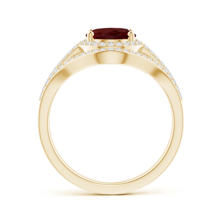 9x7mm AAA Triple Shank Oval Garnet and Diamond Halo Ring in Yellow Gold product image