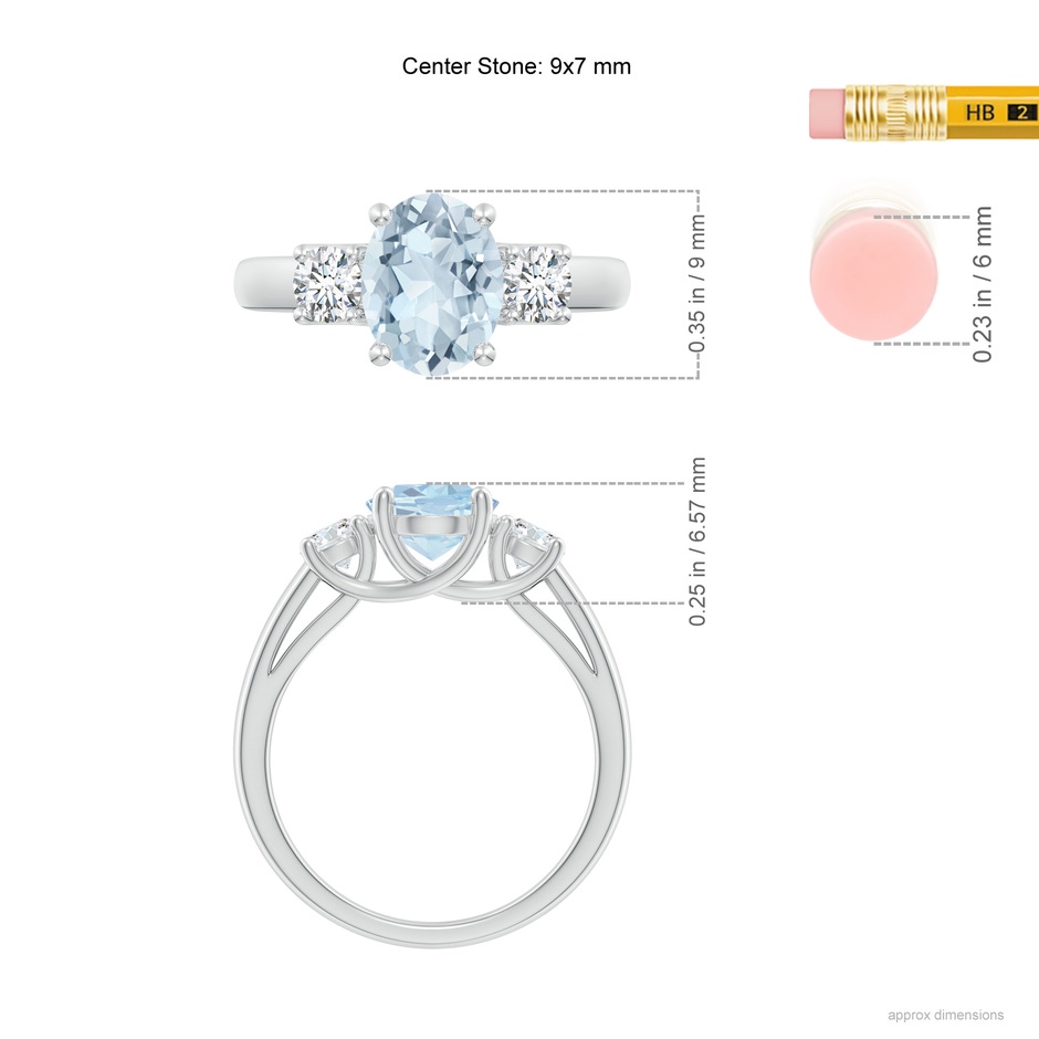 9x7mm A Oval Aquamarine and Round Diamond Three Stone Ring in White Gold ruler