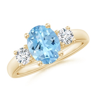 9x7mm AAAA Oval Aquamarine and Round Diamond Three Stone Ring in 9K Yellow Gold