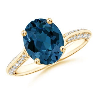 10x8mm AAA Oval London Blue Topaz Bypass Ring with Diamond Accents in Yellow Gold