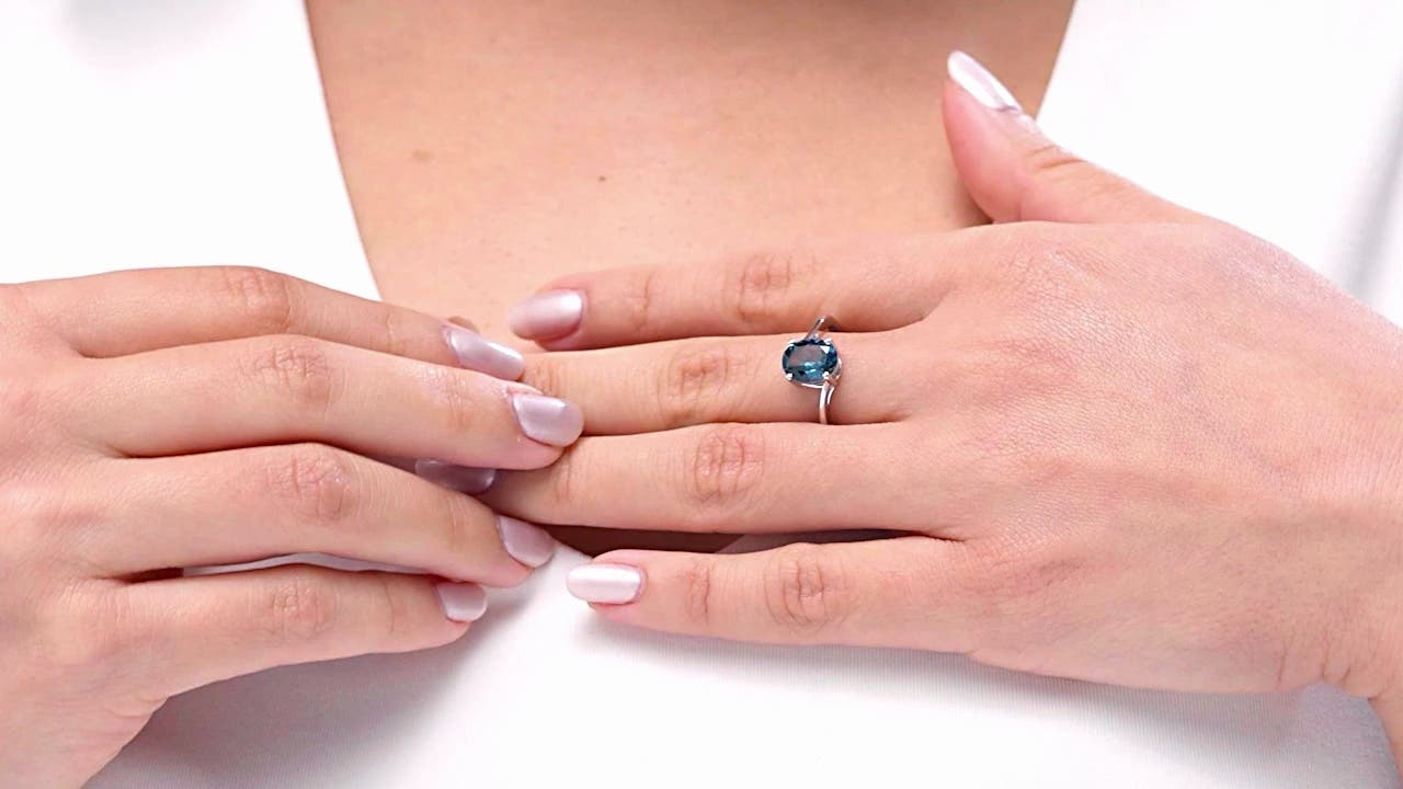 Prong Set Oval London Blue Topaz Solitaire Bypass Ring