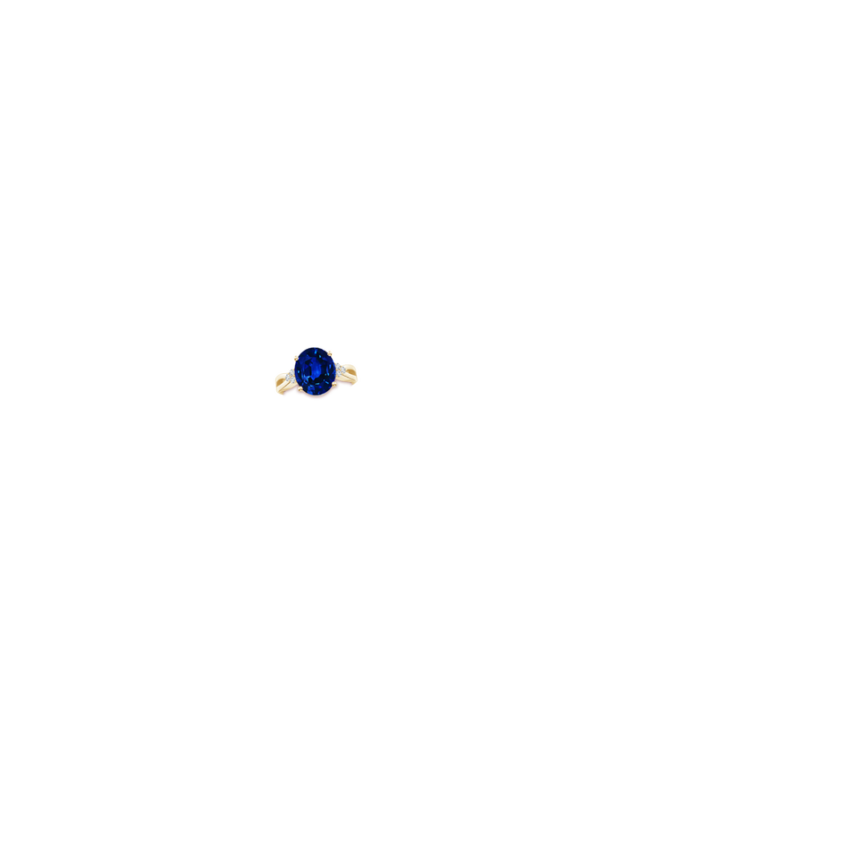 12x10mm Lab-Grown Solitaire Oval Blue Sapphire Split Shank Ring with Trio Diamonds in Yellow Gold hand