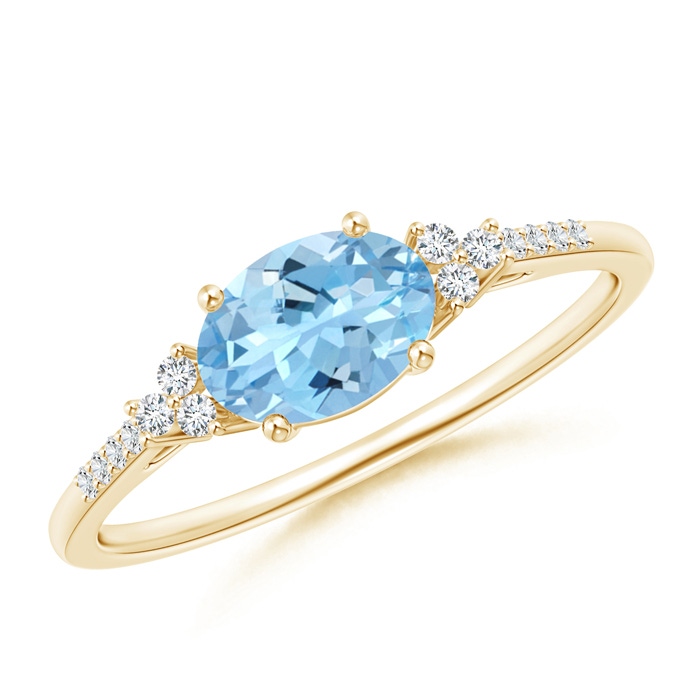 7x5mm AAAA Horizontally Set Oval Aquamarine Solitaire Ring with Trio Diamond Accents in Yellow Gold 