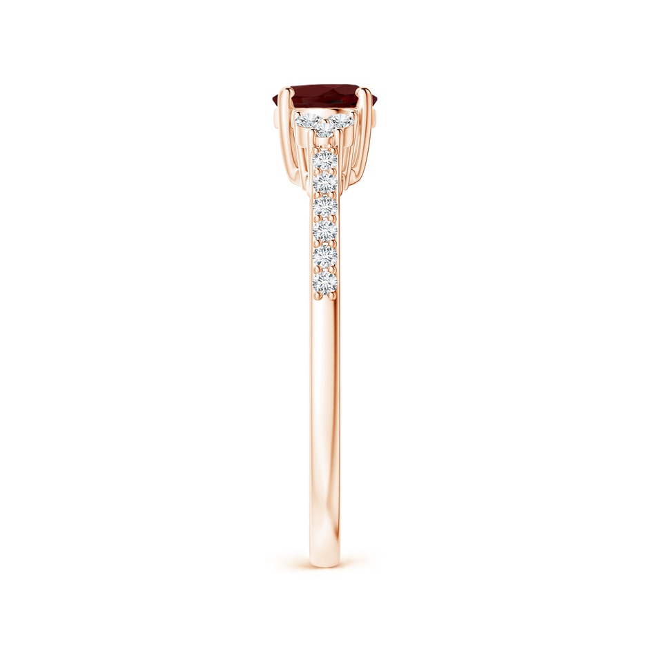 7x5mm AAA Horizontally Set Oval Garnet Solitaire Ring with Trio Diamond Accents in Rose Gold side-2