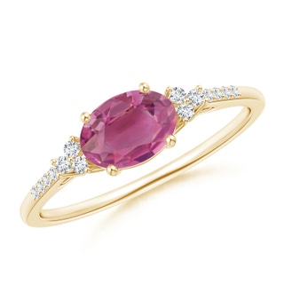 7x5mm AAA Horizontally Set Oval Pink Tourmaline Solitaire Ring with Trio Diamond Accents in Yellow Gold