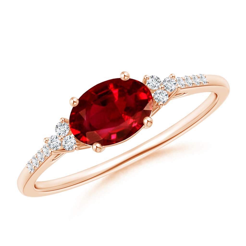 7x5mm AAAA Horizontally Set Oval Ruby Solitaire Ring with Trio Diamond Accents in Rose Gold