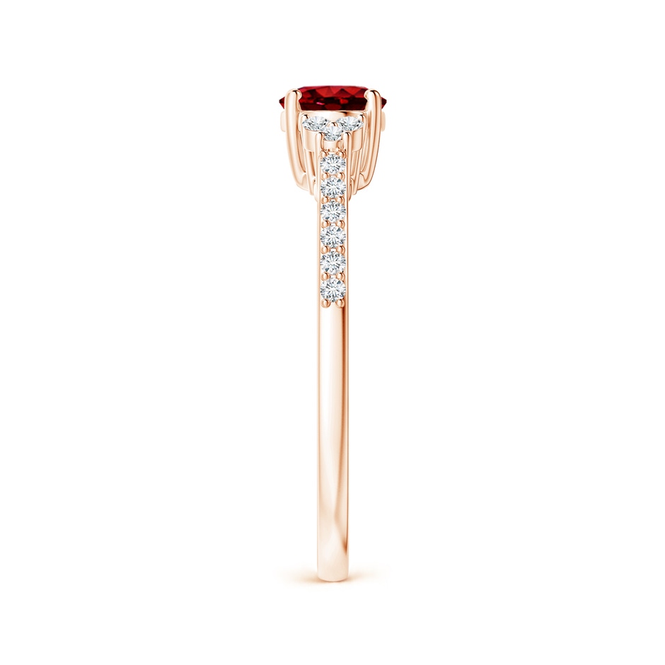 7x5mm AAAA Horizontally Set Oval Ruby Solitaire Ring with Trio Diamond Accents in Rose Gold side 299