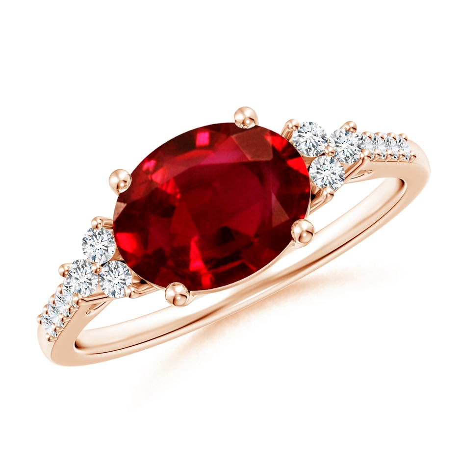 9x7mm AAAA Horizontally Set Oval Ruby Solitaire Ring with Trio Diamond Accents in Rose Gold 