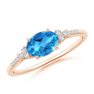 7x5mm AAAA Horizontally Set Oval Swiss Blue Topaz Ring with Trio Diamonds in 9K Rose Gold