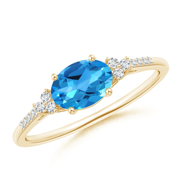 7x5mm AAAA Horizontally Set Oval Swiss Blue Topaz Ring with Trio Diamonds in Yellow Gold