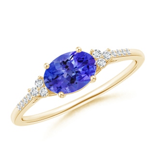 7x5mm AAA Horizontally Set Oval Tanzanite Solitaire Ring with Trio Diamond Accents in 9K Yellow Gold