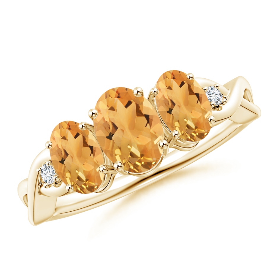 7x5mm A Oval Citrine Three Stone Criss-Cross Ring in Yellow Gold 