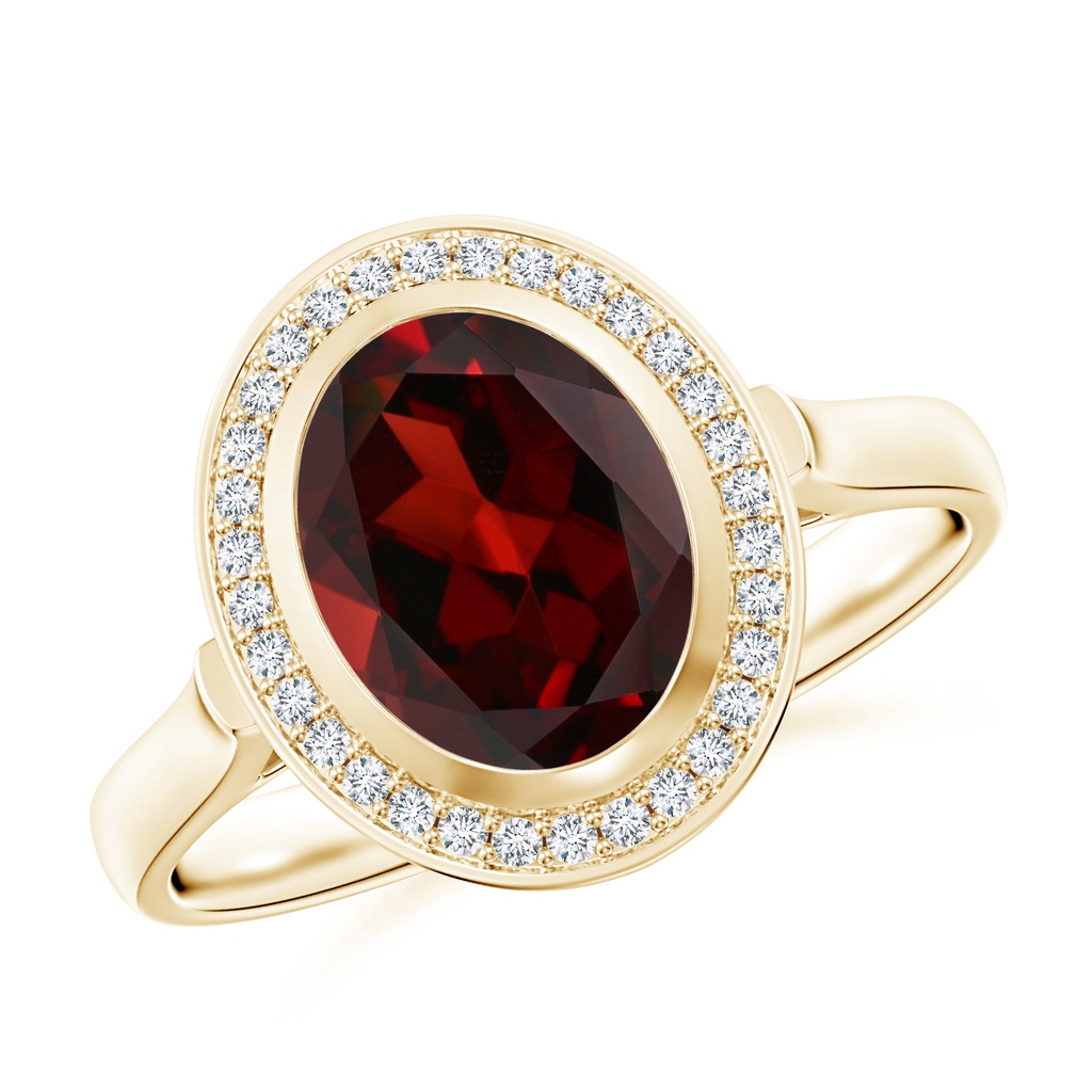 9x7mm AAA Bezel-Set Oval Garnet Ring with Diamond Halo in Yellow Gold