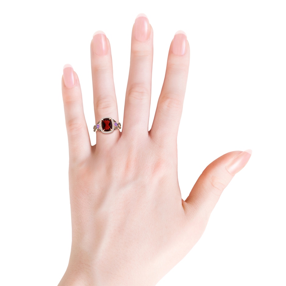 9x7mm AAA Garnet and Amethyst Crossover Ring with Halo in Rose Gold body-hand