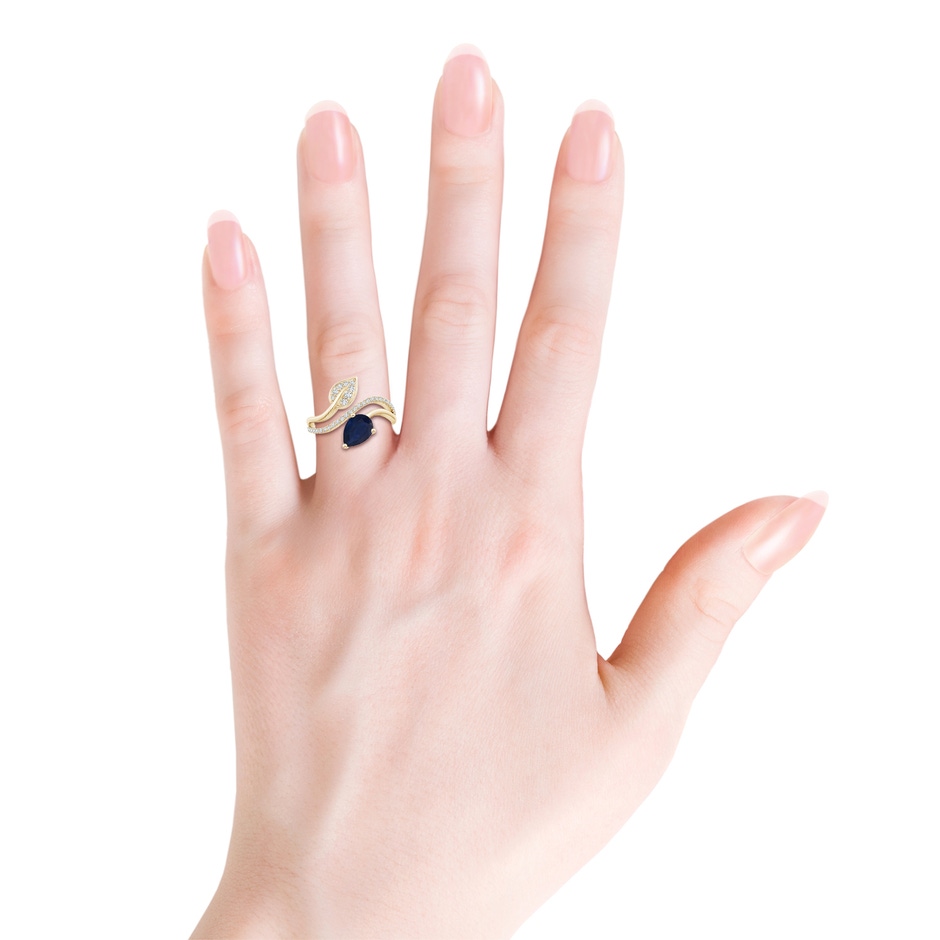 8x6mm A Sapphire and Diamond Bypass Ring with Leaf Motif in Yellow Gold body-hand